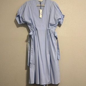 57. Baby blue dress with sashes that draw and tie on each side.